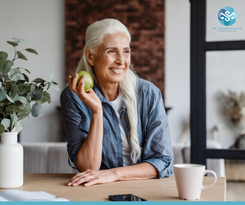 Older Woman Holding an Apple - Diet and Exercise for Menopause | Menopause | Diet During Menopause | Foods to Avoid During Menopause | Natural Ways to Manage Menopause 